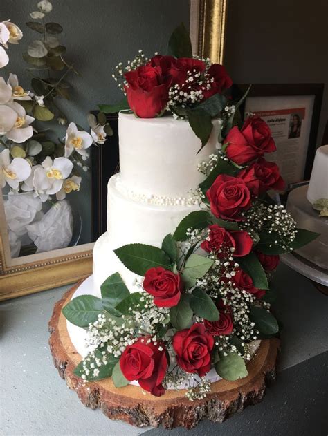 Add Bold Red Roses Touch To Your Wedding Cake To Give A Festive Yet Romantic Touch