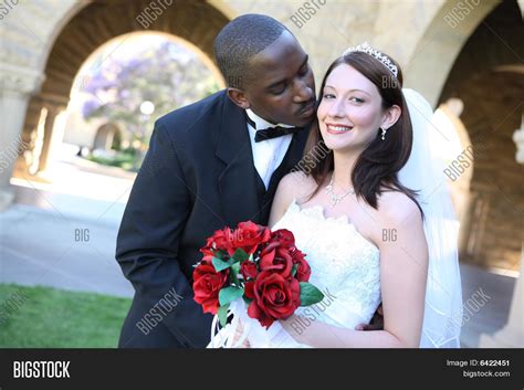 attractive interracial wedding image and photo bigstock
