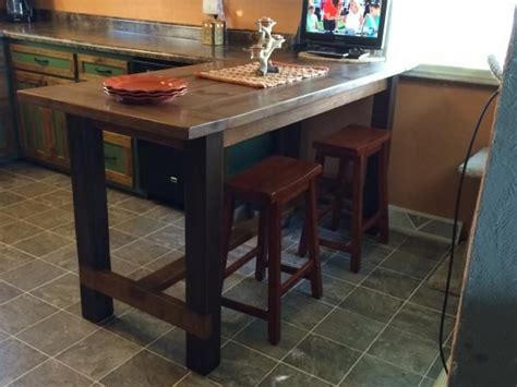 It's inspired by a pottery barn farmhouse table but only costs $100 to build. Farm House Table | Counter height kitchen table, Bar table diy, Kitchen bar table