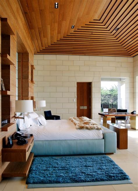 Dark wooden false ceilings lend a regal effect. 33 examples of modern living room ceiling design. | Interior Design Ideas - Ofdesign