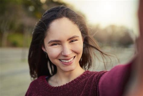 But First A Selfie Portrait Of A Happy Young Woman Taking A Selfie