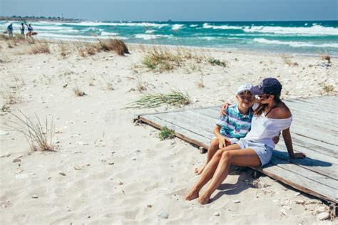Mom And Son Relaxing And Hugging On The Beach Stock Image Image Of