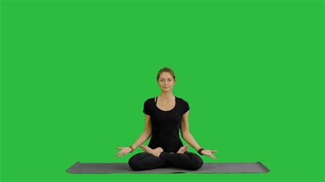 woman practicing yoga in lotus pose with stock footage sbv 314311449 storyblocks