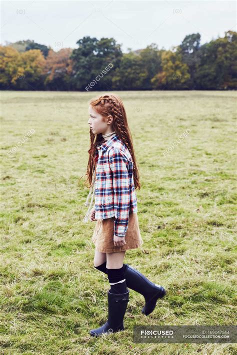 Young Girl Walking Through Field — One Person Female Stock Photo