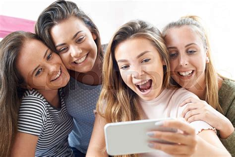 Group Of Teenage Girls Taking Selfie On Mobile Phone Stock Image Colourbox