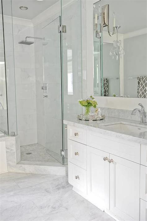 Gray grout makes the brick pattern on the walls a. Going for this look. Light grey floor tiles, white vanity ...