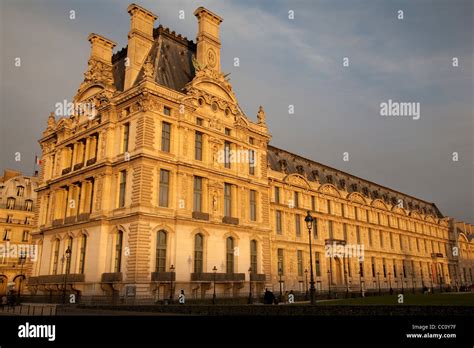 Facade Of The Louvre Art Museum In Winter Evening Light In Paris