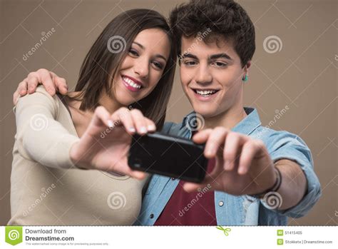 Young Couple Taking Selfies Stock Image Image Of Positivity Phone 51415405