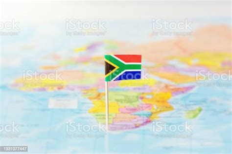 Flag Of South Africa Flying Proudly Over A Map Of The Country Stock
