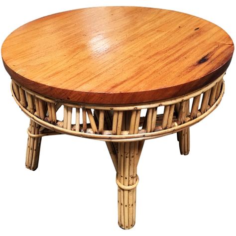 Therefore, each piece is unique. Restored Round Stick Rattan Coffee Table with Mahogany Top For Sale at 1stdibs