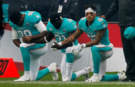 Nfl Football Nfl Player Stretching During National Anthem