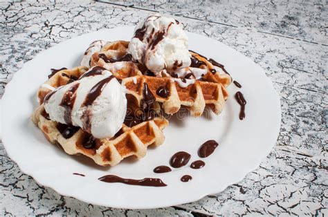 Belgian Waffle With Ice Cream Chocolate On A Wooden Background Stock