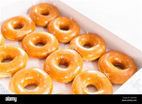 Plain Glazed Store Bought Doughnuts In A White Paper Box Stock Photo