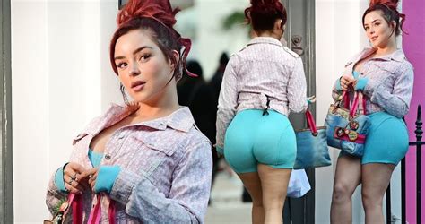 Demi Rose Showcases Her Alluring Curves In Form Fitting Cycling Shorts During A Captivating