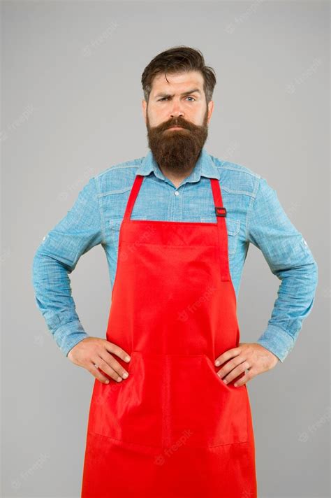 Premium Photo Bearded Chef Or Waiter Wearing Red Apron Brutal Waiter Or Barista Barber Man In