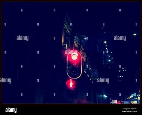 Red Traffic Light At Night Stock Photo Alamy