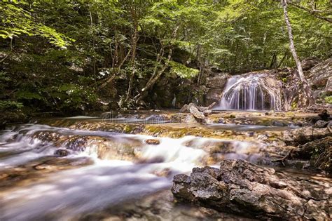 Beautiful Waterfall In Autumn Forest In Crimean Mountains Stones With