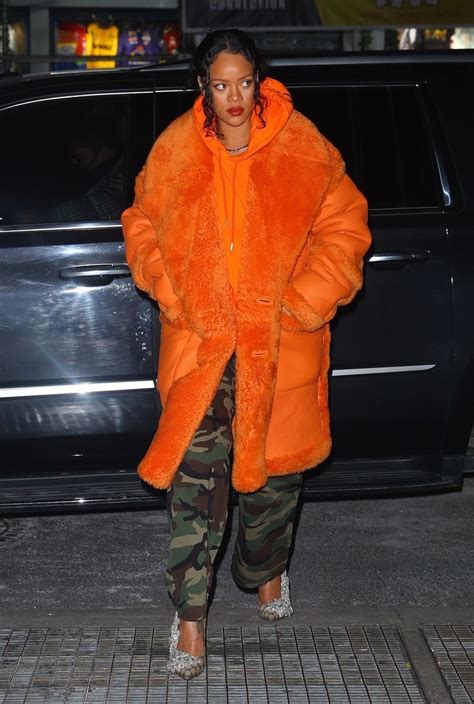 Rihanna Steps Out In An Vibrant Orange Coat After Donating 15 Million