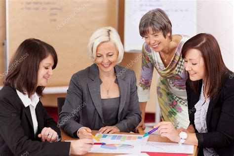 Four Women Working Together — Stock Photo © Racorn 29707649