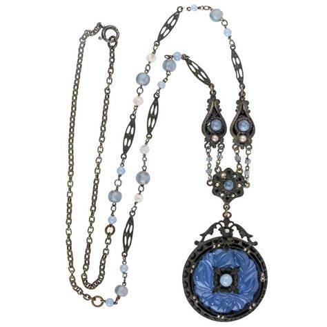 Beautiful Opaque Blue Molded Glass Pendant In An Ornate Setting With
