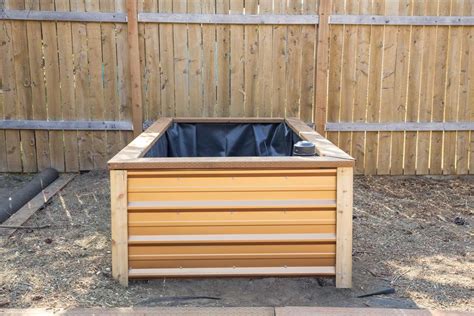 Wooden garden bed diy tutorial from sunset. Learn how to build the frame on a self watering raised bed ...