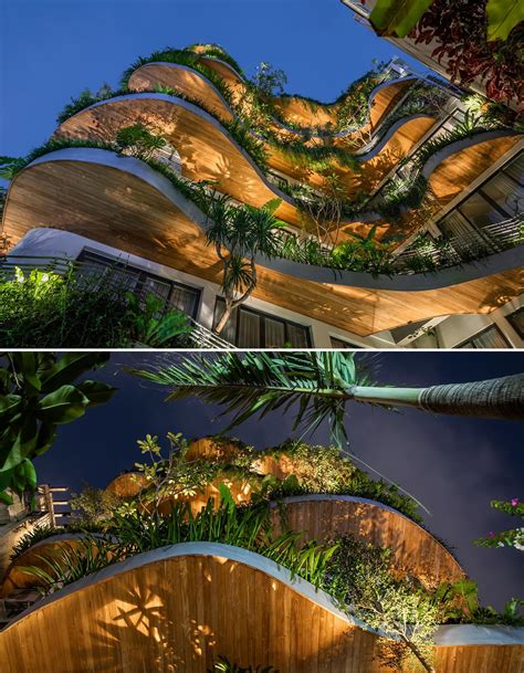 Wavy Balconies With Overhanging Plants Are A Design Feature On This