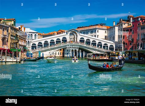 The Rialto Bridge Also Known As Ponte Di Rialto And A Gondola On The