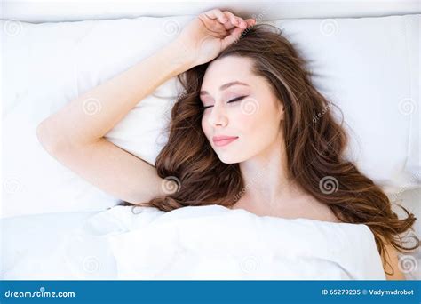 Attractive Woman With Beautiful Long Hair Sleeping In Bed Stock Image
