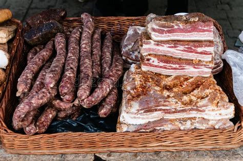 Big Chunks Of Fresh Salted Bacon And Cured Sausage On A Village Market
