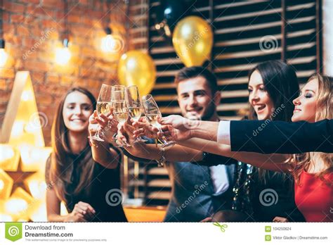 Cheers Friends With Glasses Of Champagne During Party Celebration