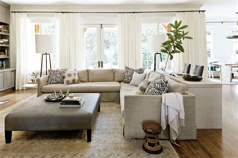 Terracotta design build grounds the light walls and drapery with a dark red area rug and gray arm chairs, while the gold accents pop throughout the space. We Love This Gray Paint Color for Living Rooms - Southern ...