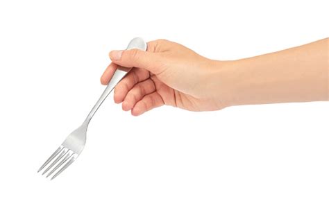 Female Hands Hold A Fork Isolated On White Background Stock Photo