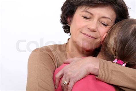 Grandmother Hugging Her Granddaughter Stock Image Colourbox