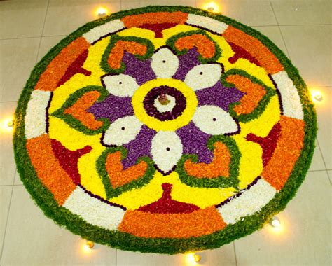The flower arrangement is a petal carpet made to welcome the wealthiest king and seek his blessings (prosperity). flower carpet | Pookkalam | Glen Mendez | Flickr