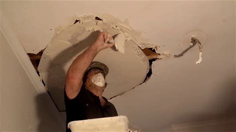 Put the wooden braces that you made out of plywood into the hole and lay it flat over your ceiling, so there is a two inch (5.08 cm) overlap over your hole. Large Hole in Plaster Ceiling Repair - YouTube