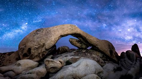 The Milky Way Formed Over Arch Rock In Joshua Tree National Park