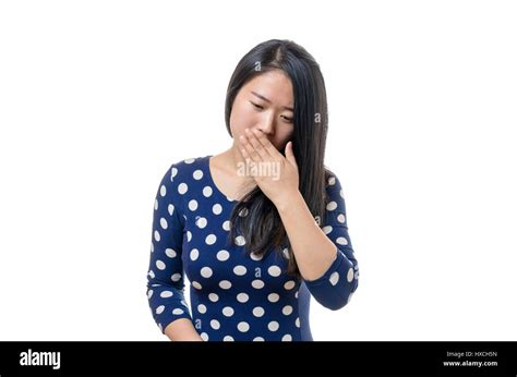 Polite Young Chinese Woman Coughing Into Her Hand To Avoid Spreading