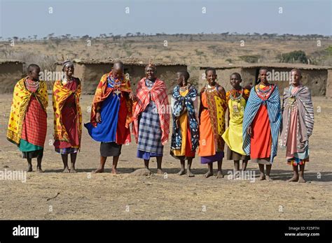 kenya masai mara reserve masai women performing a traditional welcome of singing in a village