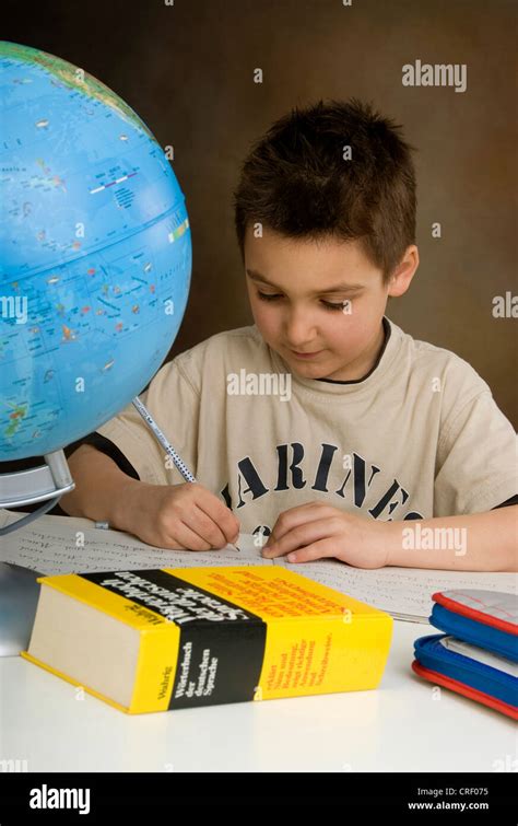 School Boy Doing Homework Stock Photo Alamy