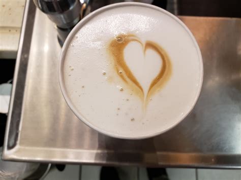 Latte macchiato served with a heart in the middle r starbucks
