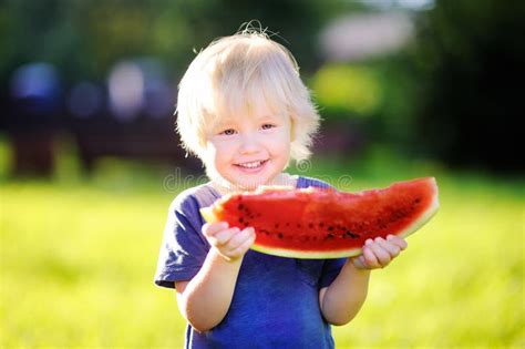 Little Boy With Blond Hairs Eating Fresh Watermelon Stock Image Image
