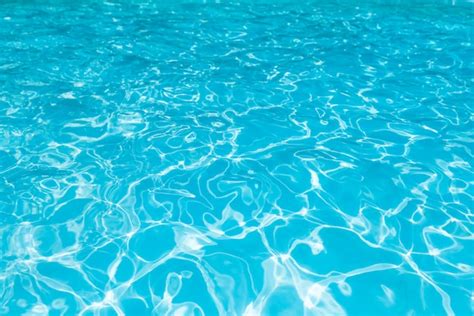 Premium Photo Blue And Bright Water Surface And Ripple Wave With Sun Reflection In Swimming Pool