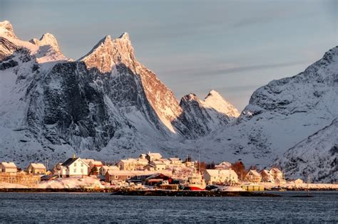Premium Photo Sunrise On Scandinavian Village With Snow Mountain