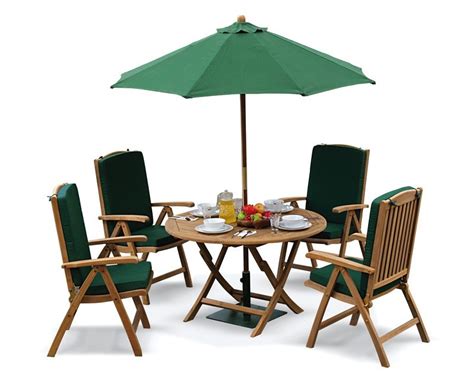 Check out our garden table selection for the very best in unique or custom, handmade pieces from our patio furniture shops. Suffolk 4 Seater Teak Round Garden Table and Chairs Set