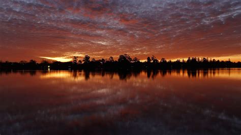Download Wallpaper 1366x768 Sunset Trees Water Reflection Tablet