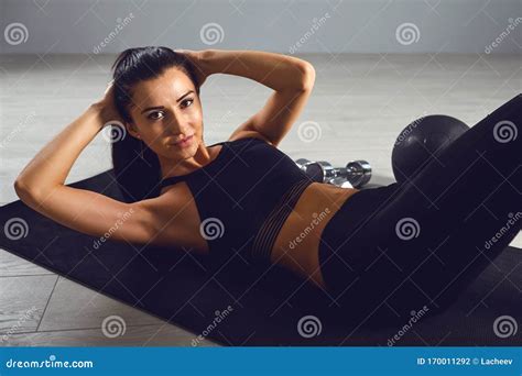 Exercises Abs Sporty Girl In Black Sportswear Doing Abc Exercises Indoors Stock Photo Image