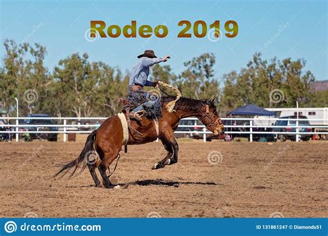 Rodeo 2019 Text Cowboy Riding A Bucking Bronc Horse At A Country