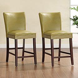 This stylish dining chair can bring a modern feel to your restaurant. TRIBECCA HOME Estonia Olive Green Upholstered Counter ...