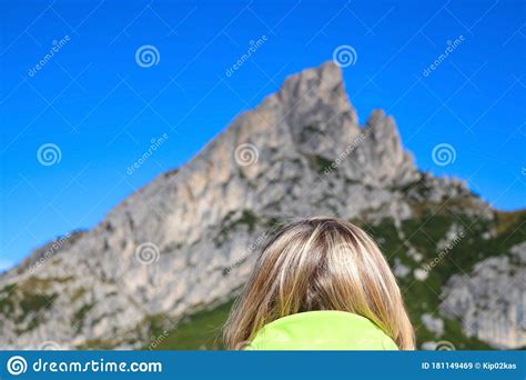 A Girl Looks At The Dolomites In Italy Back View Stock Image Image