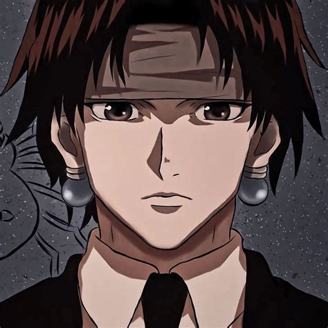 An Anime Character With Black Hair And Large Earrings On His Head